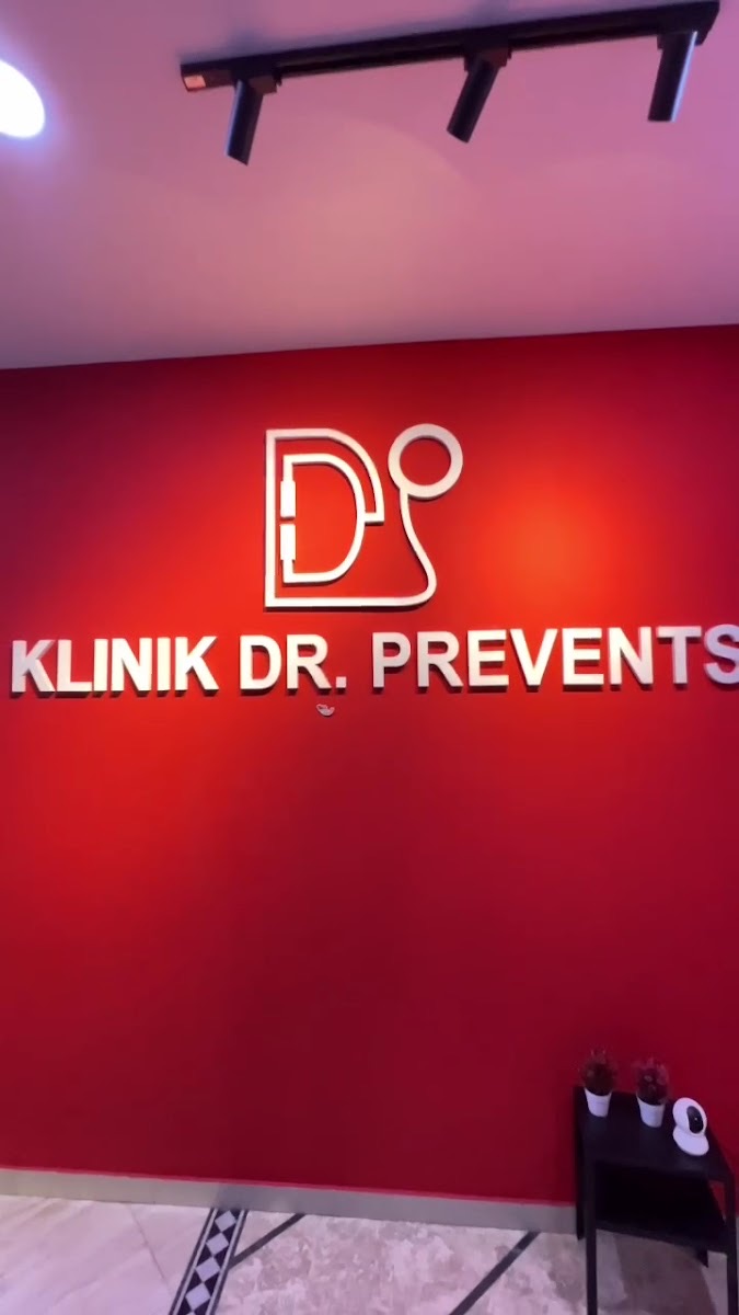 Red Klinik Dr. Prevents logo wall at the Bandar Sri Damansara clinic